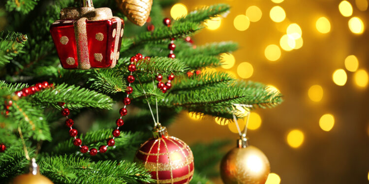 Decorated Christmas tree on  blurred, sparkling and fairy background; Shutterstock ID 228613051; PO: TODAY.COM