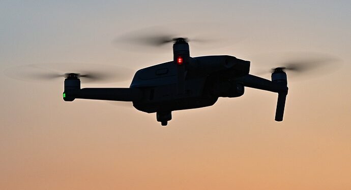 26 March 2021, Brandenburg, Sieversdorf: A DJI Mavic Air 2 quadrocopter (drone) flies over a field at sunset. Photo: Patrick Pleul/dpa-Zentralbild/ZB (Photo by Patrick Pleul/picture alliance via Getty Images)