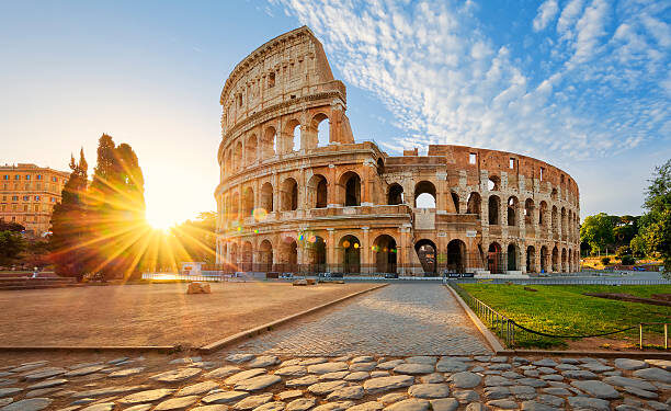 View of Colosseum in Rome and morning sun, Italy, Europe.