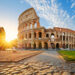 View of Colosseum in Rome and morning sun, Italy, Europe.
